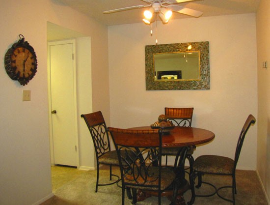Pier Landing Apartments interior of apartment looking at model of dining room area leading into kitchen