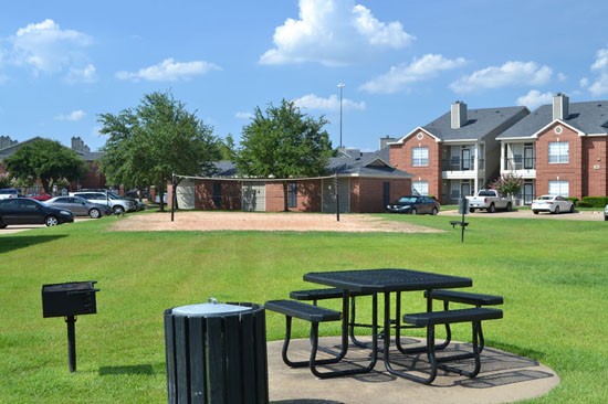 Champion Lake Apartments Outside Picnic Area With Parking Lot