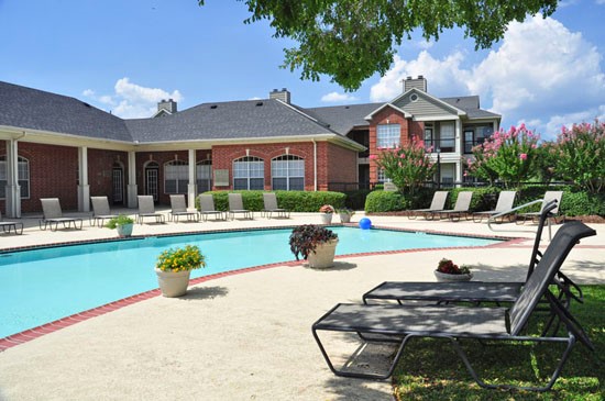 Champion Lake Apartments Farside Pool View Onlooking Clubhouse and Over Head Patio