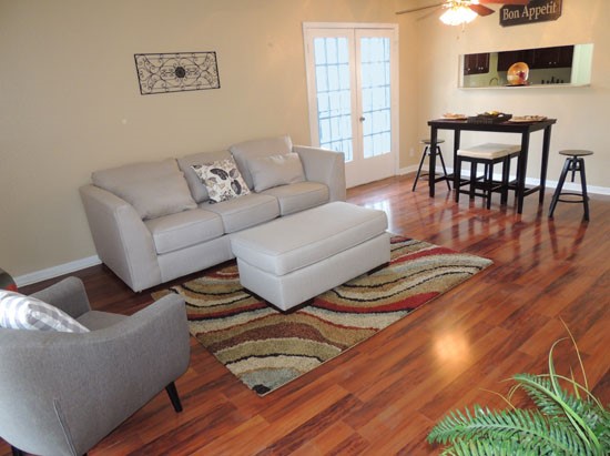 Chimney Hills Apartments Big Open Living Room with Backdoor to Porch