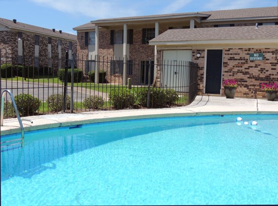 Colony Square Apartments Huge Clean Pool with Fence and Back Entrance Into Front Office