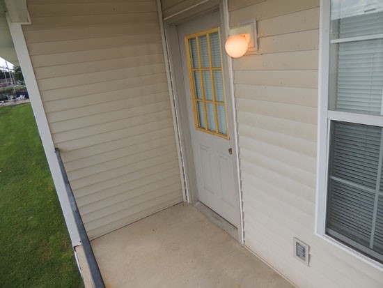 Fox Creek first floor model balcony looking at back door into apartment