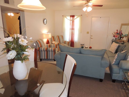 Heritage Village Apartments interior of beautiful open living room area to front door and hallway with bedrooms