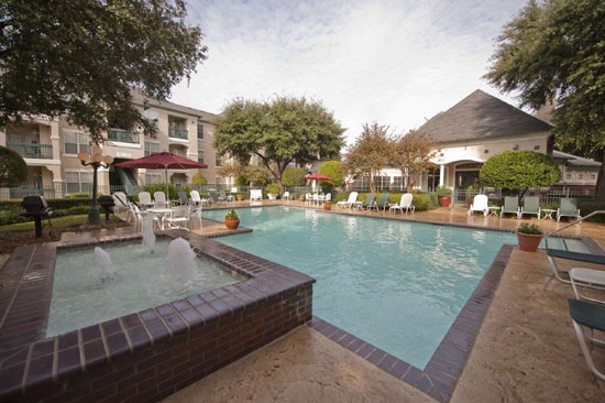 La Crosse Apartments look at small water fountain next to pool