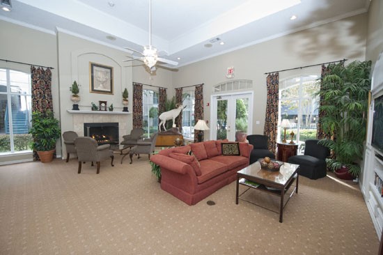 La Crosse full view of living area, big windows, lots of lounge chair