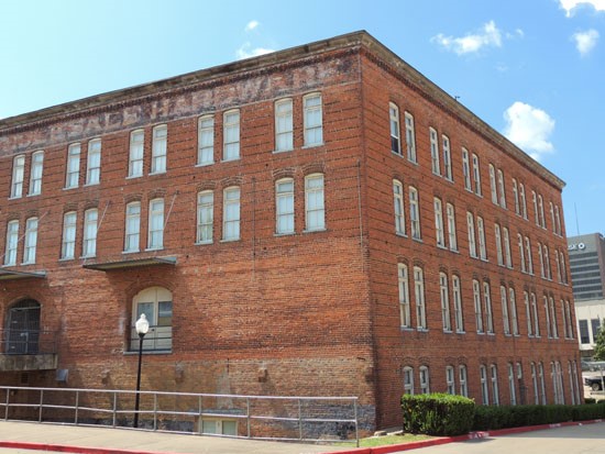 Lee Hardware Apartments in downtown shreveport, big old red buildings with lots of windows