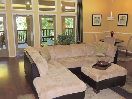 Riverbend comfortable lounge area in living room with huge windows