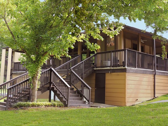 Riverbend Apartments staircases leading up to front office building under the overhead patio area