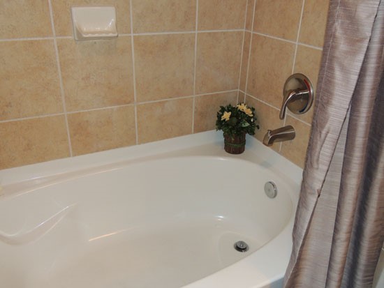 Springridge model of bathtub/ shower with nice tile wall