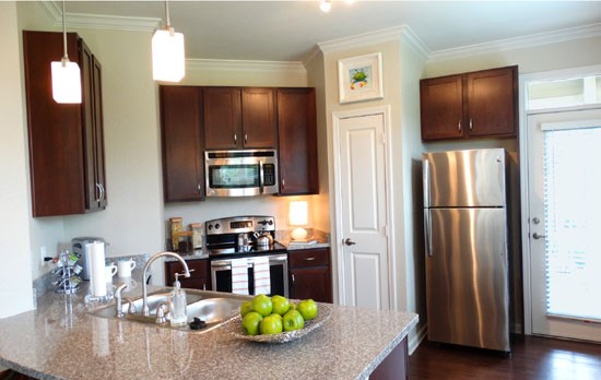 Boulders on Fern Apartments tall open kitchen with small bar area