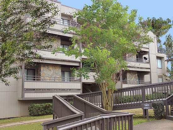 Towers of Cross Lake exterior of apartment building with ramp, and balconies