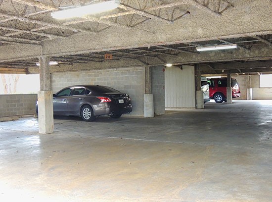 Towers of Cross Lake Apartments parking garage with lots of space