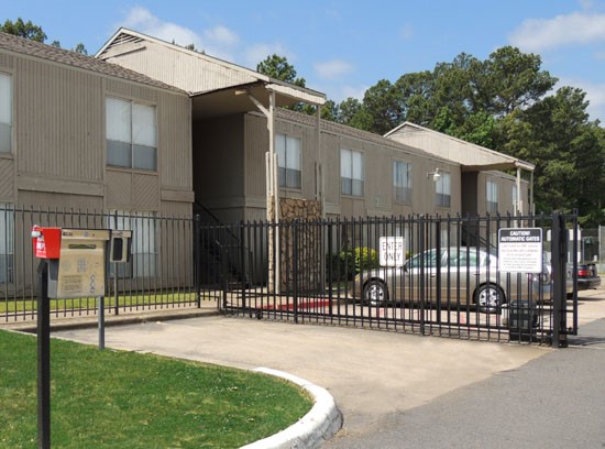 Tree Tops Apartments gate entrance into complex with keypad