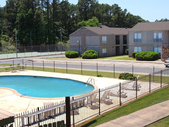 Tree Tops above look at gated pool area with lounge chairs