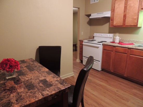 Woodland Terrance Apartments open model dining room area looking into kitchen in Shreveport dining room