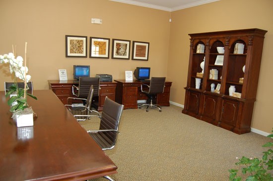 Westlake Apartments business room with desk and computers