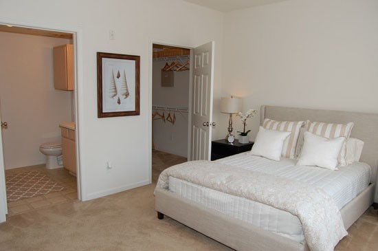 Westlake Apartments big white model bedroom with walk in closet, and private bathroom